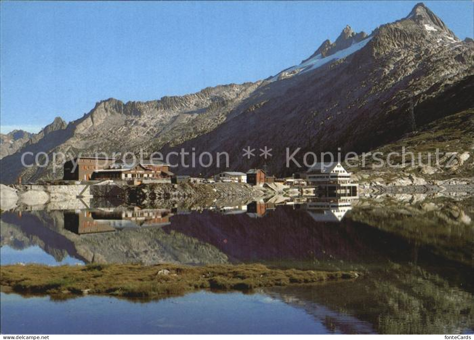 12455547 Grimsel Passhoehe Berghotel Totensee Wasserspiegelung Berner Alpen Grim - Sonstige & Ohne Zuordnung