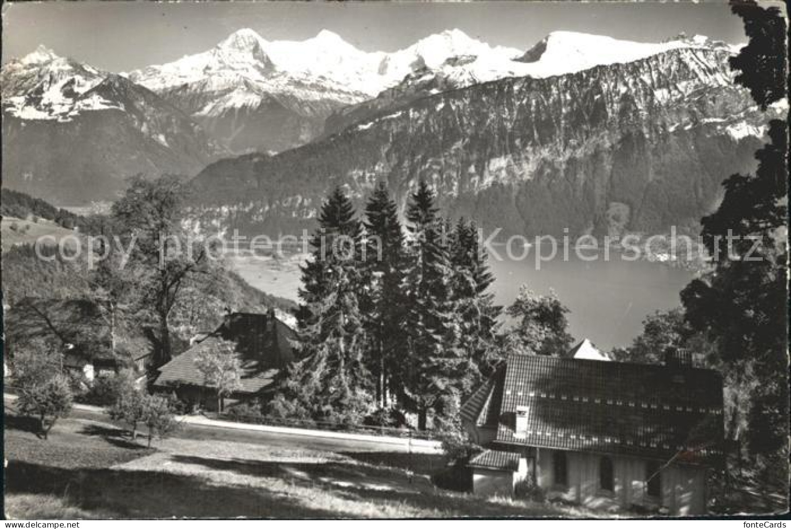 12364989 Beatenberg Ref Und Kath Kirche Thunersee Eiger Moench Jungfrau Beatenbe - Other & Unclassified
