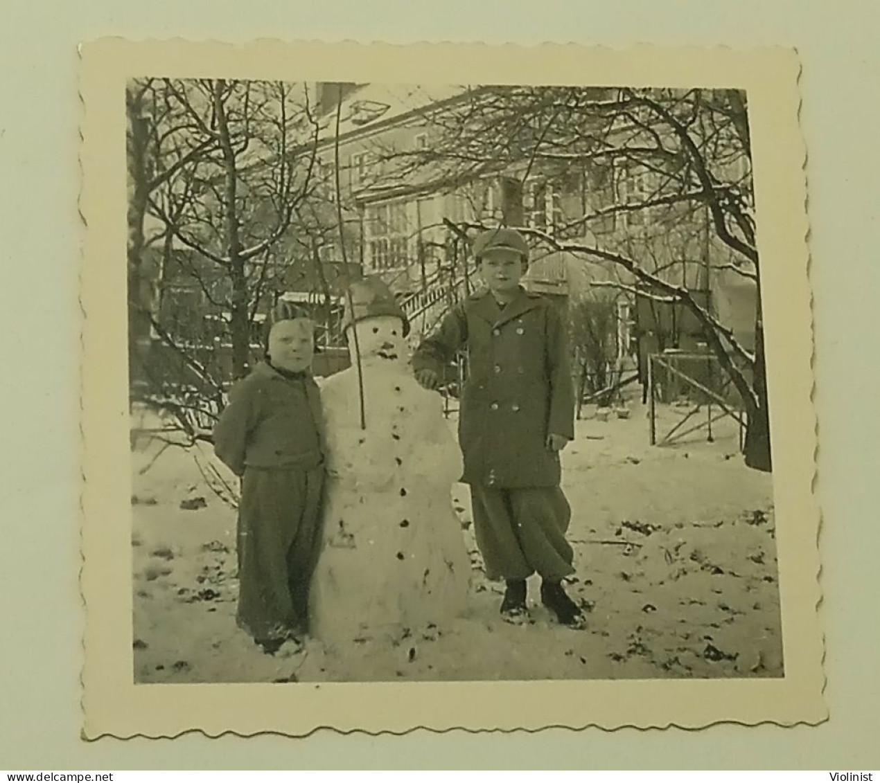 Two Boys Next To Snowman - Anonymous Persons