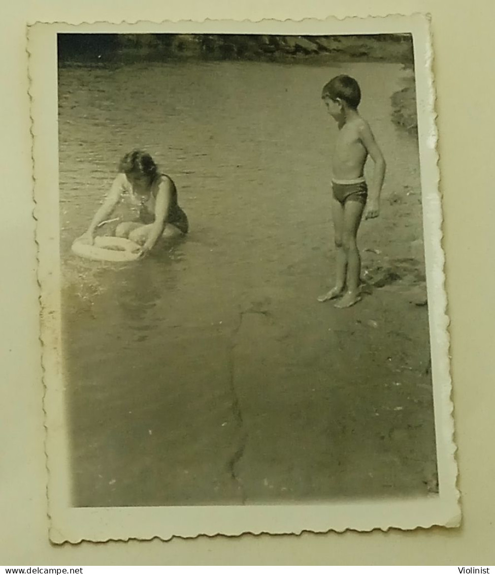 A Boy And A Woman On The River - Anonymous Persons