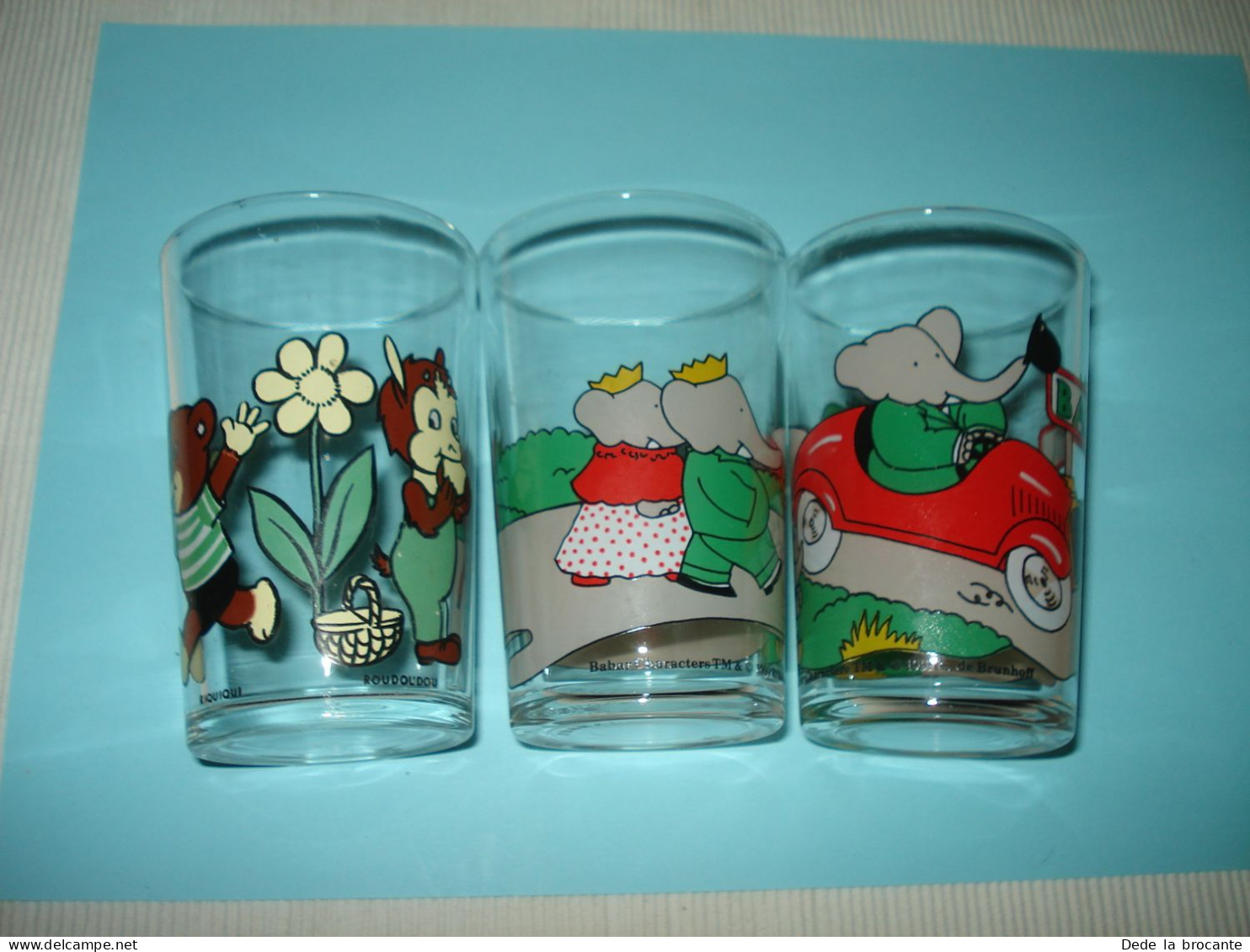 O20 ( 13 ) / Lot De 3 Verres Dessin Animé - 2 X Babar + Riquiqui Et Roudoudou - Advertisement