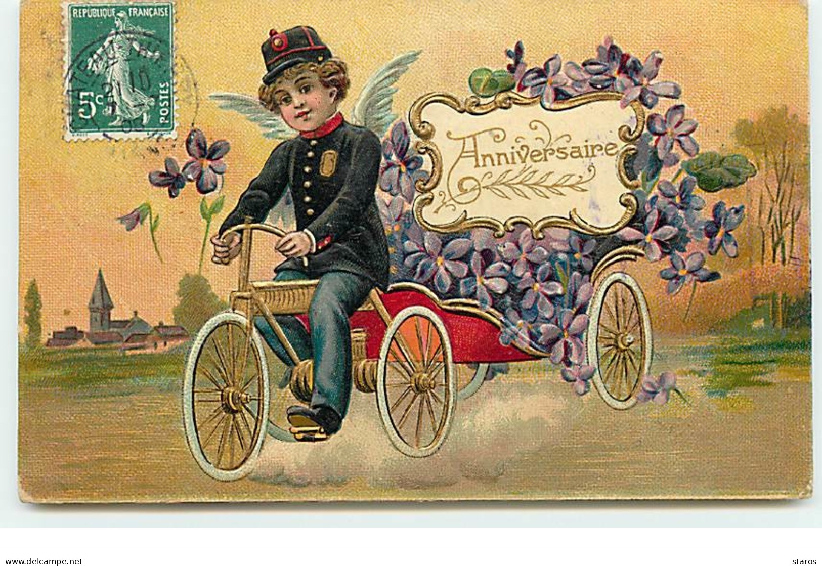 Carte Gaufrée - Anniversaire - Ange Pédalant Sur Un Vélo Tirant Une Charrette Remplie De Violettes - Geburtstag