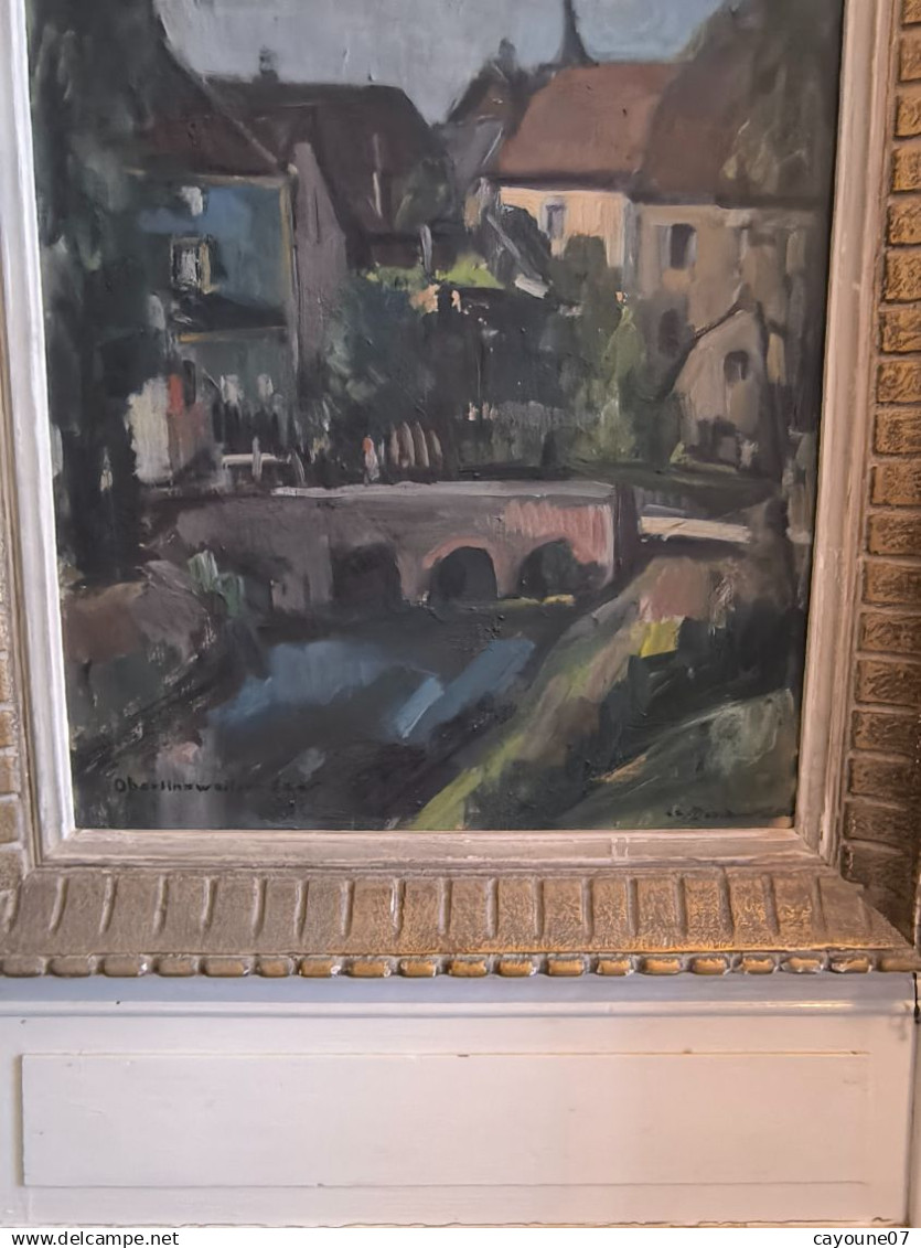 MIELLER (XXéme) Huile Sur Isorel " Vue De Oberlinxweiler Saar " Datée 1943  Cadre Montparnasse 62 X78 Cm - Oils