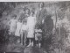 1934 CPA /RPPC >Une Belle Famille Nombreuse (six Enfants)ds Jardin Exotique Dame Habillée Robe à Pois Photo Photographie - Anonyme Personen