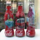 AC - COCA COLA ISTANBUL SERIES SHRINK WRAPPED 3 EMPTY GLASS BOTTLES & CROWN CAPS - Flessen