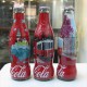AC - COCA COLA ISTANBUL SERIES SHRINK WRAPPED 3 EMPTY GLASS BOTTLES & CROWN CAPS - Bottiglie