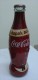 AC - COCA COLA - OPEN A CROWN TO HAPPINESS 2010 SHRINK WRAPPED EMPTY GLASS BOTTLE - Bottles