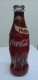 AC - COCA COLA - OPEN A CROWN TO HAPPINESS 2010 SHRINK WRAPPED EMPTY GLASS BOTTLE - Flaschen