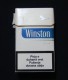 KOSOVO (SERBIA) WINSTON BLUE EMPTY HARD PACK, USA CIGARETTES KOSOVO EDITION WITH FISCAL REVENUE STAMP. - Boites à Tabac Vides