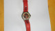 MONTRE USAGEE DOMI A AIGUILLE. DATE ?.  BRACELET ROUGE. - Montres Modernes