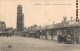 RARE CPA : CAMBRAI LA PLACE D'ARMES BARAQUEMENTS EPICERIE H. DELCAROIX CHAPELLERIE GUERRE BEFFROI 59 NORD - Cambrai