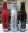 AC - COCA COLA BEAR ILLUSTRATED ALUMINUM EMPTY BOTTLES 3 PIECES SET & CROWN CAPS - Bottles