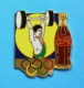 1 PIN'S  //   ** COCA COLA ** JO ** HALTÉROPHILIE ** . (Worldwide Olympic Sponsors &reg; C.O.A. A.O.C. Artiss-Regina) - Coca-Cola