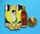 1 PIN'S  //   ** COCA COLA ** JO ** HALTÉROPHILIE ** . (Worldwide Olympic Sponsors &reg; C.O.A. A.O.C. Artiss-Regina) - Coca-Cola