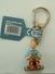 PORTE CLEFS - TINTIN ASSIS TIBET - OFFICIEL - Porte-clefs