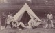 GROUP OF MEN OUTSIDE TENT - Other & Unclassified