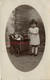 Carte Photo-années 20-petite Fille Et Sa Poupée Dans Une Poussette-puppe-doll-1er Mai (muguet Dans Sa Main) - Personas Anónimos