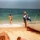 Photo Carrée Couleur Vintage 1980's - Maillots De Bains à La Plage & Détente Ensoleillée Pour Ces Femmes D'âges Opposés - Personnes Anonymes