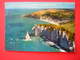 CPM  ETRETAT L'AIGUILLE LA PORTE D4AVAL LA PLAGE ET LES FALAISES    VOYAGEE 1971 TIMBRE - Etretat