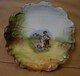 Lot. 1119. Assiette En Limoge, Enfant Avec Un Chien Tenant Un Panier. - Limoges (FRA)