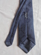 Delcampe - Vintage - Cravate Noire Vêtements Sano Lavelanet Années 60 - Cravates