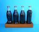 CROATIAN ISSUE ... COCA-COLA 125. YEARS - Full Set Of 4. Glass Bottles * FULL UNOPENED BOTTLES ON A SPECIAL RACK - Bottles