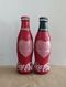 AC - COCA COLA HEARTH ILLUSTRATED SUGARLESS & ORIGINAL TASTE SHRINK WRAPPED 2 EMPTY GLASS BOTTLES & CROWN CAPSES & C - Bouteilles