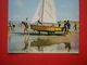 CPM OU CPSM    BATEAU  VOILIER  MISE A L'EAU  VOYAGEE 1964 TIMBRE - Voile