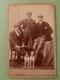 52150: PHOTO On Hard Backing By F.H.Robinson, Chichester. Three Men & Two Dogs. Early 20c. - Anonymous Persons