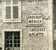 Meuse ( 55 ) Lérouville . Route De Chonville .( Publicité Au Mur Chocolat Menier, Chicorée Arlatte ) - Lerouville