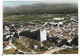 CPSM EN AVION AU DESSUS DE... GIGNAC, VUE AERIENNE SUR LA TOUR, VUE GENERALE, AU FOND, LES H.L.M, HLM, HERAULT 34 - Gignac