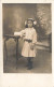 CPA - Photographie -Petite Fille Debout Près D'une Table - Carte Postale Ancienne - Portraits