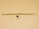 Delcampe - -BRACELET BRELOQUE COEUR YVES SAINT LAURENT Années 90 Métal Doré Résine Bleue    E - Armbanden