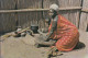 Swasiland - Housewife Grinding Mealies - Swazilandia