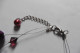 Delcampe - Collier Deux Rangs Sur Fil Cablé Perles Fantaisie Baroques Prune Et Cristaux Toupies Rouge Bordeaux - Necklaces/Chains