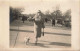 CARTE PHOTO - Une Femme Promenant Son Chien Dans La Rue - Carte Postale Ancienne - Photographie