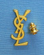 1 PIN'S //  ** YVES SAINT LAURENT / GRAND COUTURIER XX ᵉᵐᵉ SIÈCLE ** - Perfume