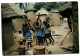 Africa In Pictures - A Group Of Women Grinding For Food - Kenya