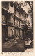 FRANCE - Lourdes - Rue Du Bourg - Notre-Dame Du Chène - Hôtel-Pension De Famille Giret-Pouey - Carte Postale Ancienne - Lourdes