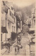 BR31. Vintage Valentines Sepiatype Postcard. Clovelly High St. Devon. Donkeys - Clovelly