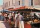 Marches - Les Marchés De Provence - Rue Pittoresque - CPM - Voir Scans Recto-Verso - Mercati