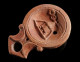 A Roman Terracotta Oil Lamp With A Cista/altar - Archaeology