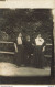 CARTE PHOTO NON IDENTIFIEE REPRESENTANT  DEUX FEMMES ET UN PETIT HOMME DEVANT UNE BARRIERE - To Identify