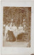 Carte Photo - Allemagne - Groupe De Personnes Assis à Une Table Dans Un Jardin - 1908 - Carte Postale Ancienne - Photographie