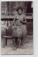 PAPUA NEW GUINEA - Papuan Nude Lady Smoking A Cigarette - REAL PHOTO - Publ. W. H. Cooper. - Papua Nuova Guinea