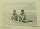 A Teenage Girl And A Boy Are Sitting On The Beach - Personnes Anonymes