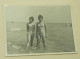 Two Teenage Girls Are Standing In The Shallow Water Of The Sea - Personnes Anonymes