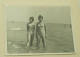 Two Teenage Girls Are Standing In The Shallow Water Of The Sea - Personnes Anonymes