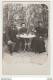 Carte Photo à Situer Famille Femme Homme Et Leur Fils ? Attablés Dans Jardin Avec Bouteille De Vin ? Et Verres VOIR DOS - Photographs