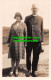R483666 Man In Dark Suit Together With Woman With Hat And Glasses. T. I. C - World